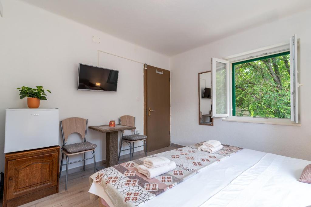Postel nebo postele na pokoji v ubytování Filomena Rooms