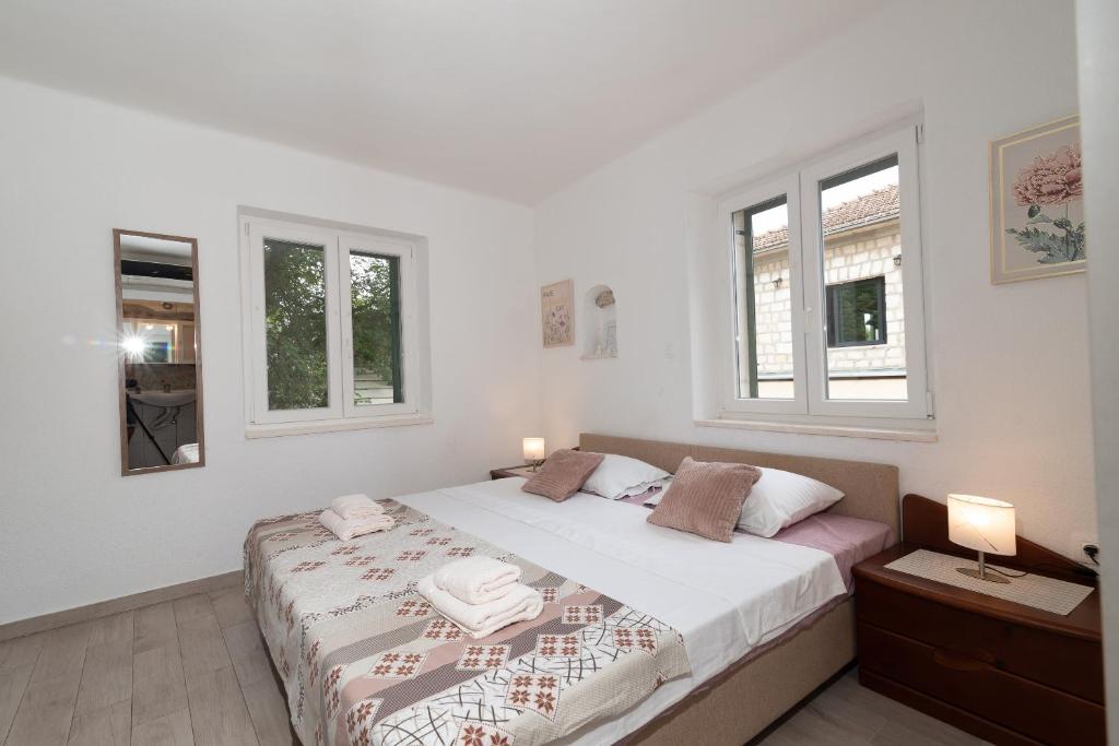 Postel nebo postele na pokoji v ubytování Filomena Rooms