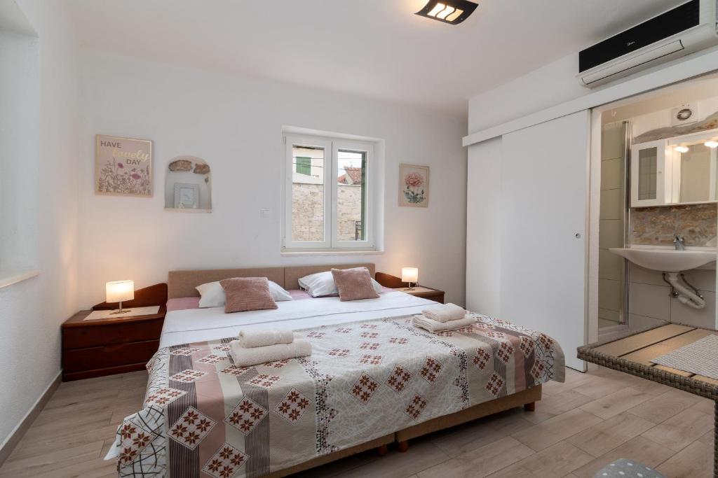 Postel nebo postele na pokoji v ubytování Filomena Rooms