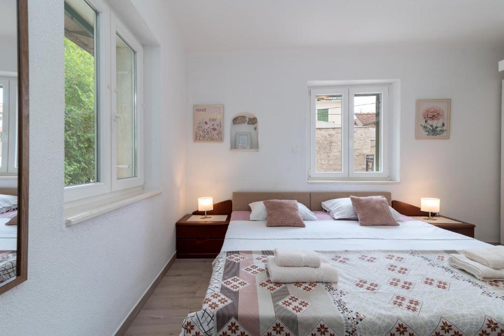 Postel nebo postele na pokoji v ubytování Filomena Rooms
