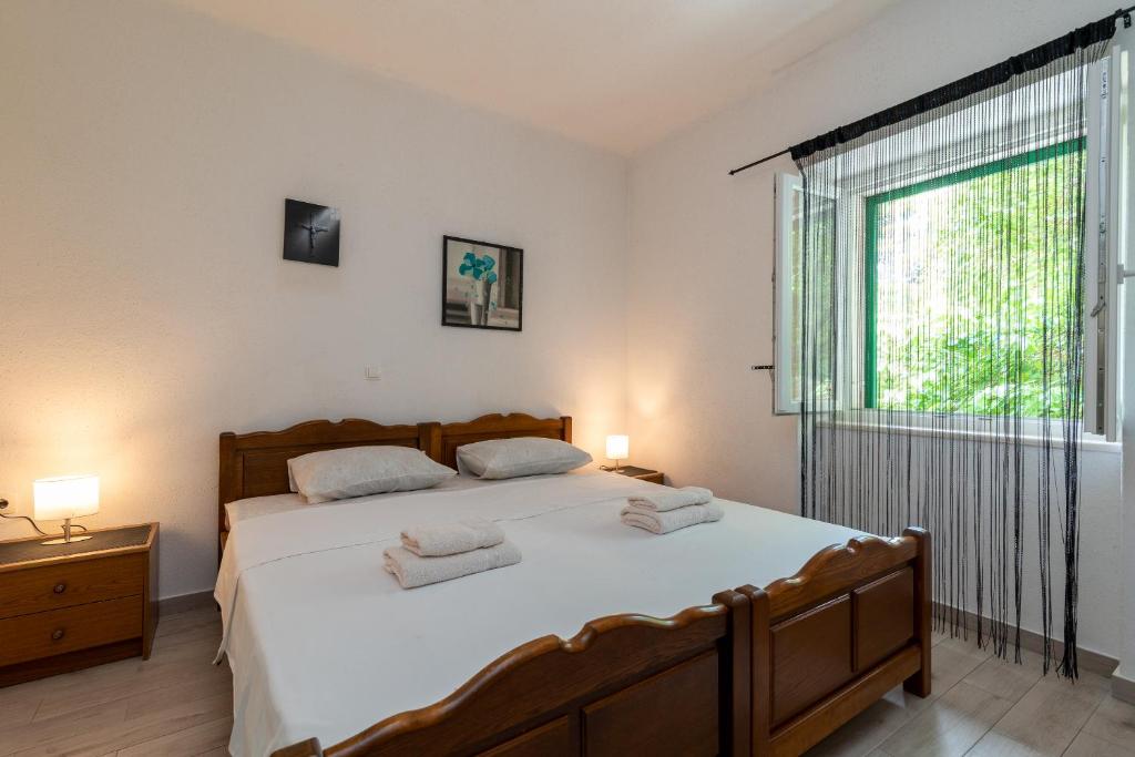 Postel nebo postele na pokoji v ubytování Filomena Rooms