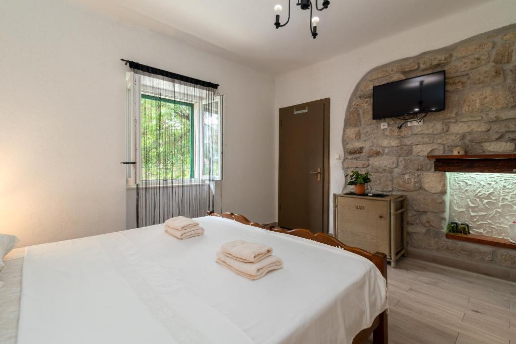 Postel nebo postele na pokoji v ubytování Filomena Rooms