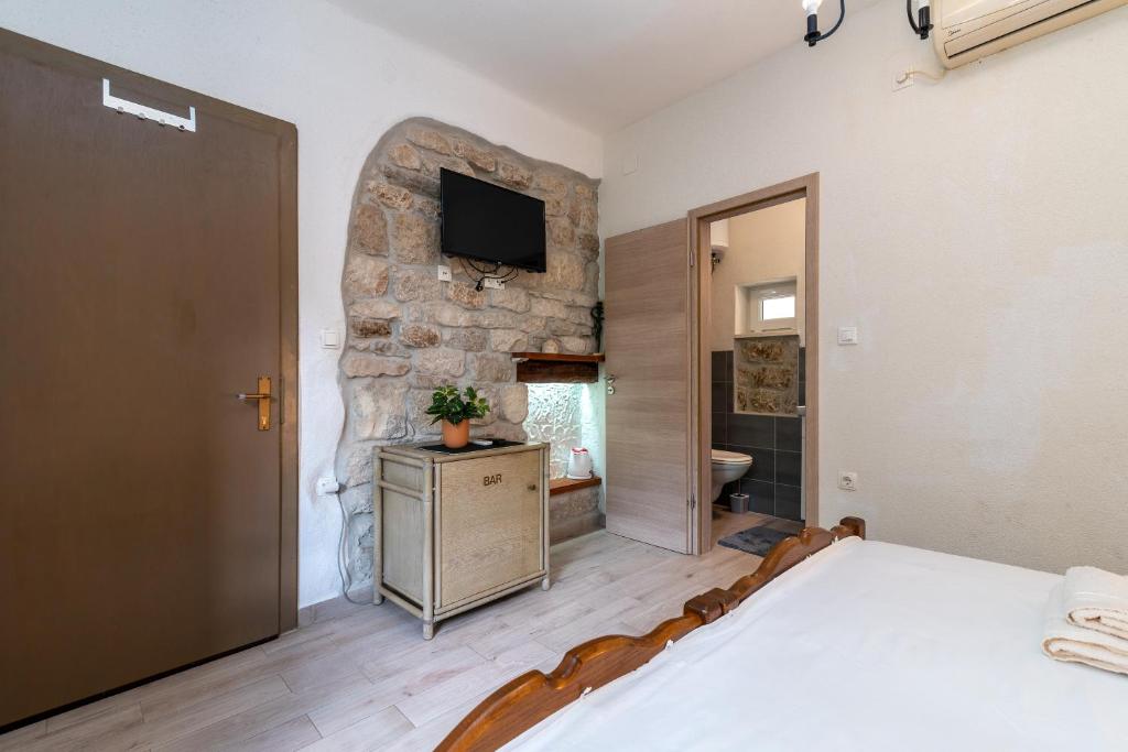 Postel nebo postele na pokoji v ubytování Filomena Rooms