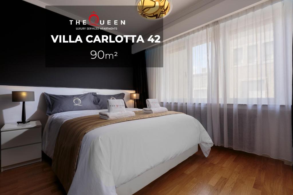 Postel nebo postele na pokoji v ubytování The Queen Luxury Apartments - Villa Carlotta