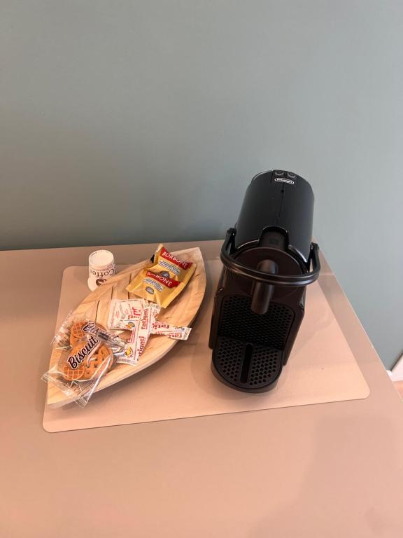 a coffee maker sitting on top of a table with food at B&B Twins in San Severo