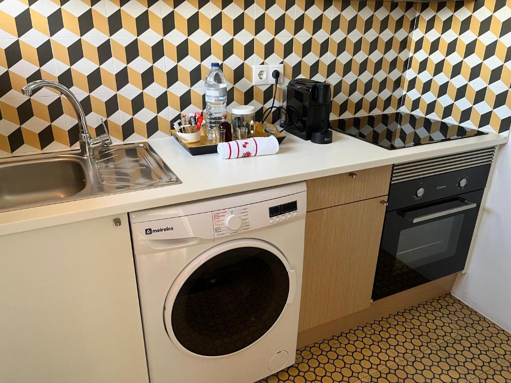 Kuchyň nebo kuchyňský kout v ubytování Apartamento Trindade