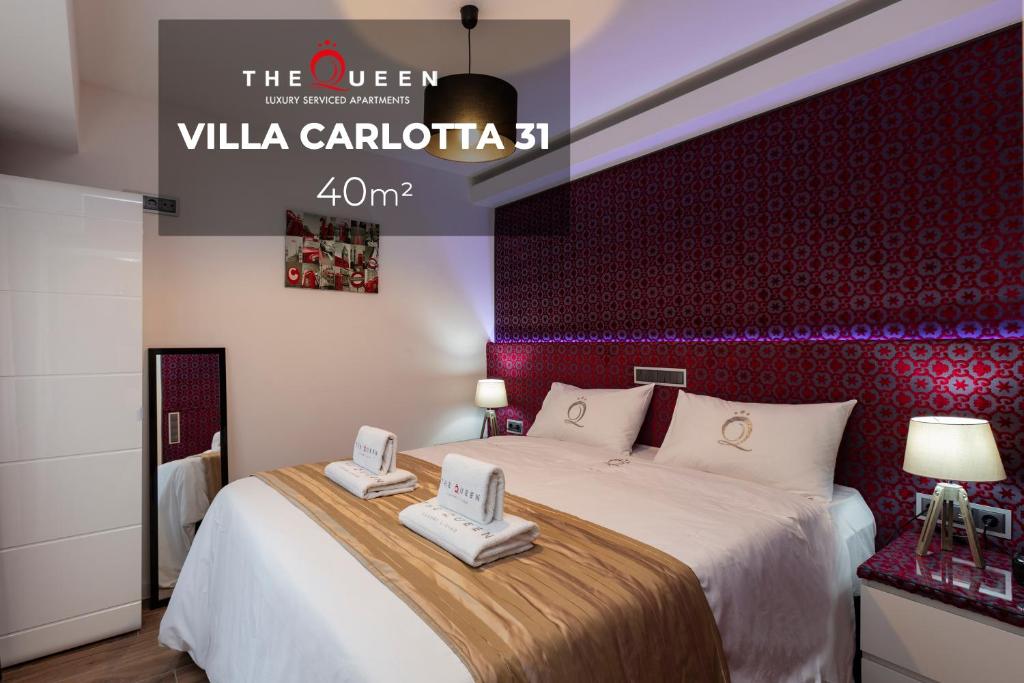 Postel nebo postele na pokoji v ubytování The Queen Luxury Apartments - Villa Carlotta