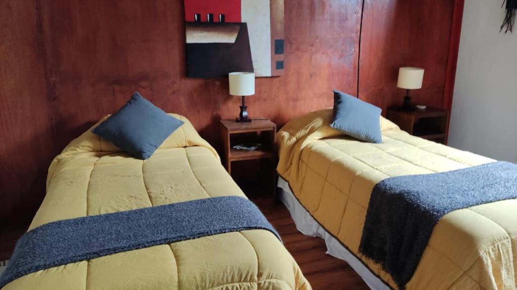 Postel nebo postele na pokoji v ubytování Refugio Los Cipreses Hotel