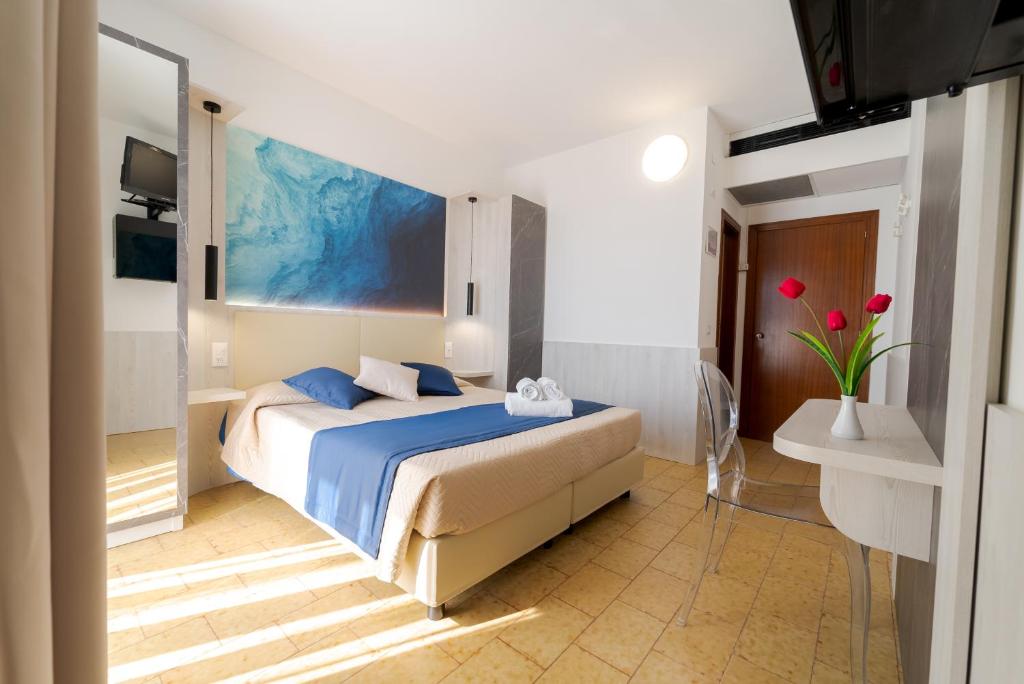 Postel nebo postele na pokoji v ubytování Hotel Beach