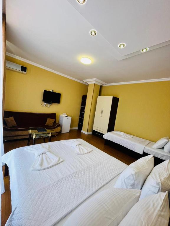 Postel nebo postele na pokoji v ubytování Hotel Albatros