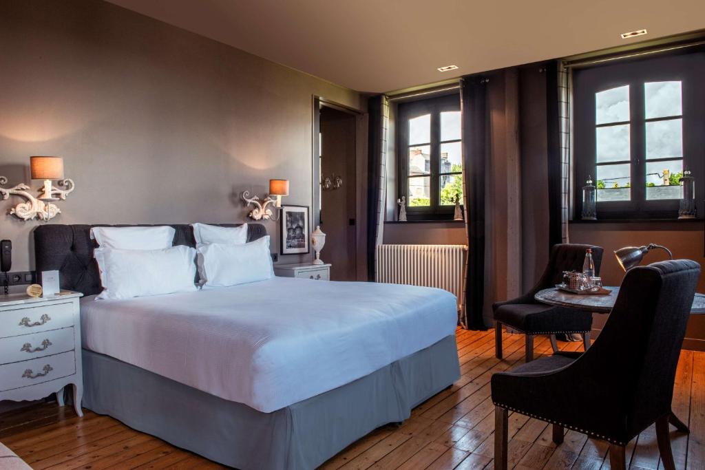 Postel nebo postele na pokoji v ubytování Les Maisons de Léa & Spa - Radisson Individuals