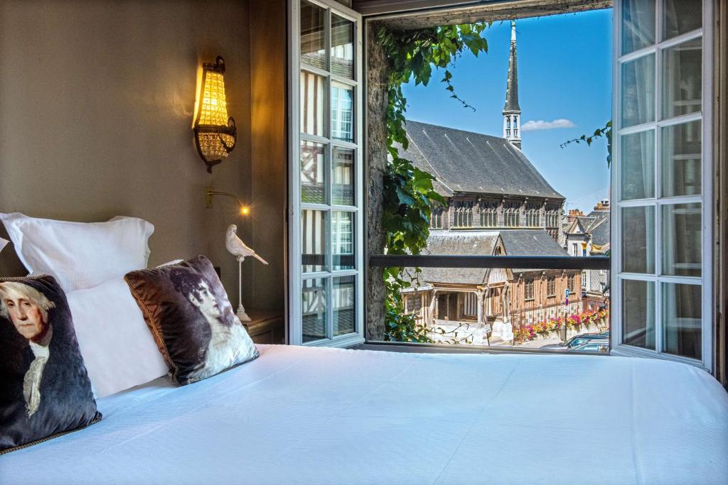 Postel nebo postele na pokoji v ubytování Les Maisons de Léa & Spa - Radisson Individuals
