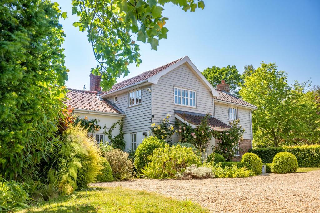 a house with a garden in front of it at Foxhole Cottage in Stowmarket