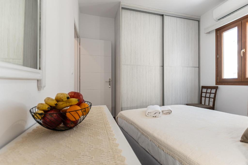 A bed or beds in a room at Naxian White House In Glinado