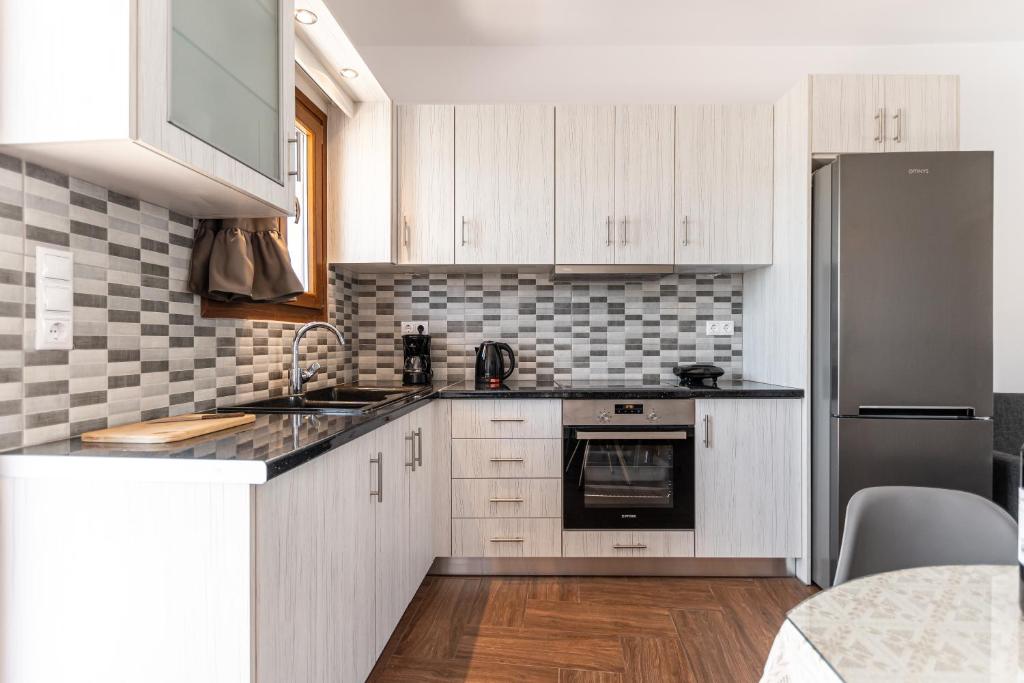 A kitchen or kitchenette at Naxian White House In Glinado