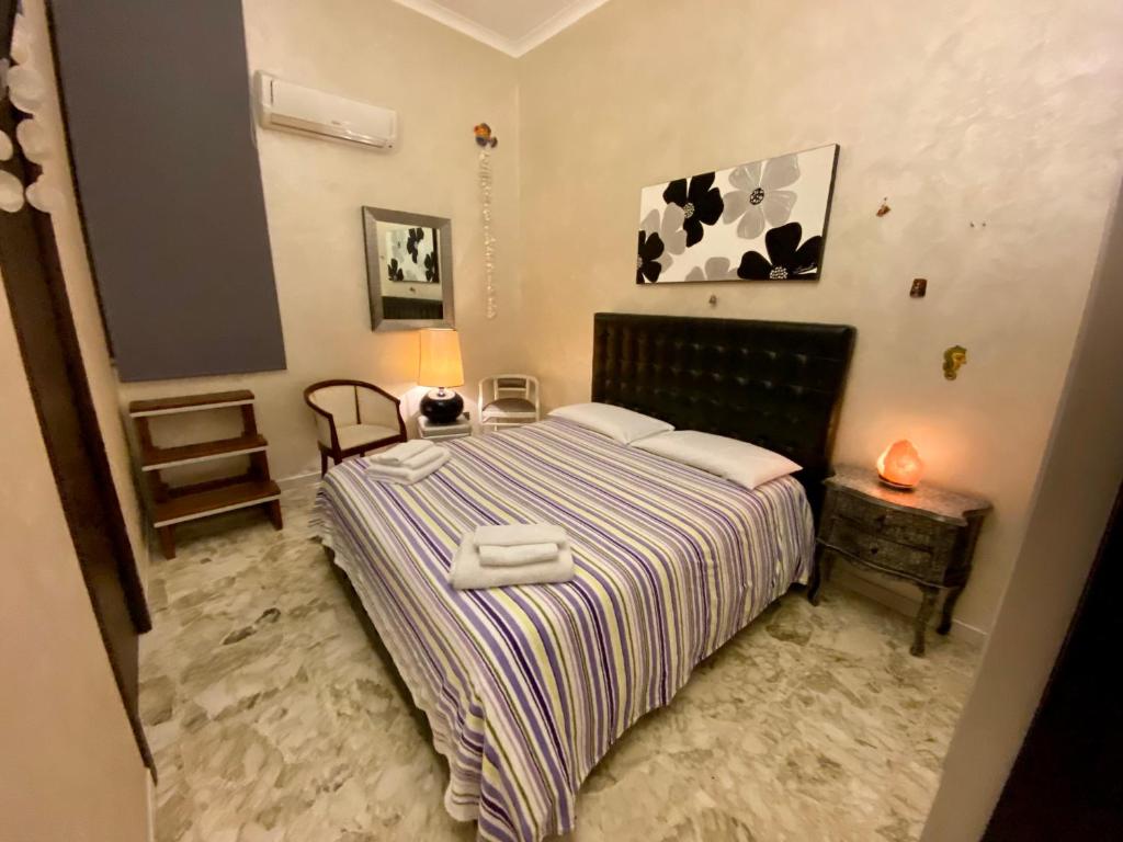 Postel nebo postele na pokoji v ubytování Pummarella b&b