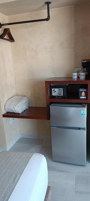 Postel nebo postele na pokoji v ubytování Hotel Yaxactun