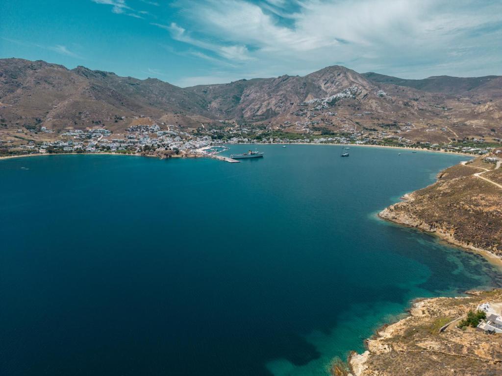 an aerial view of a body of water with mountains at Astrio Suites in Livadi