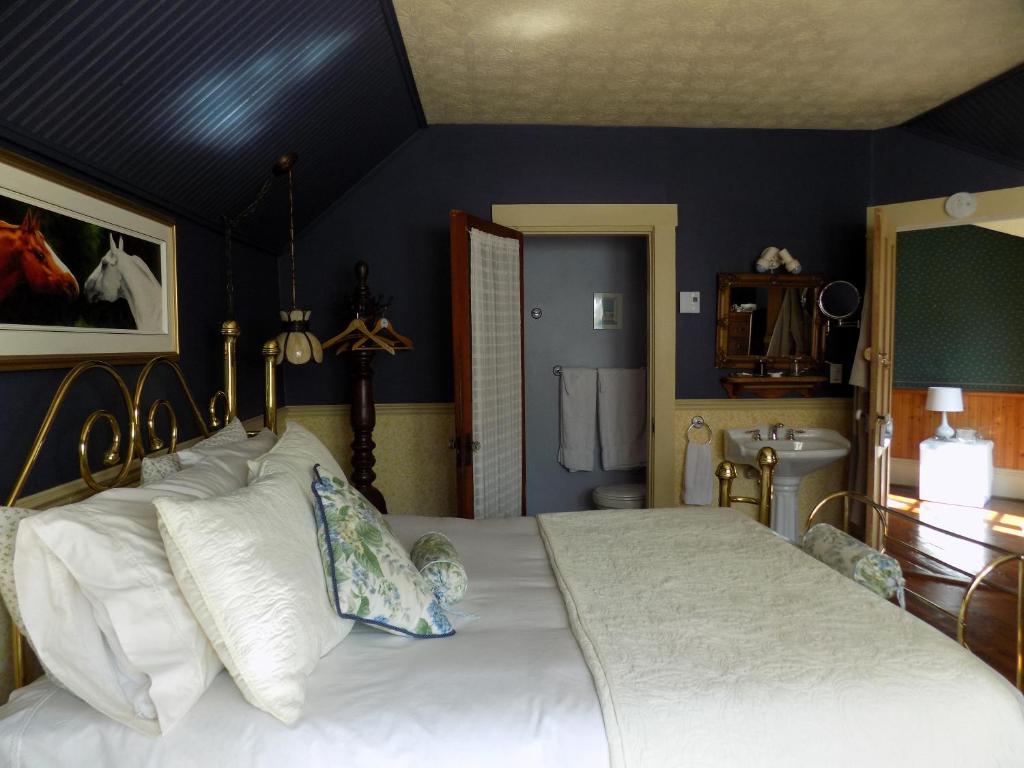 Postel nebo postele na pokoji v ubytování À L'Ancestrale B&B