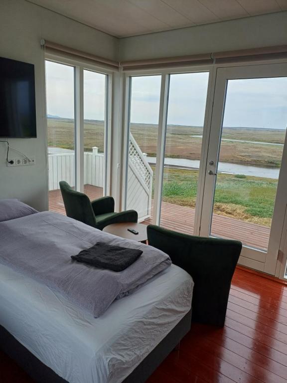 Postel nebo postele na pokoji v ubytování Grímstunga Guesthouse Hólsfjöll