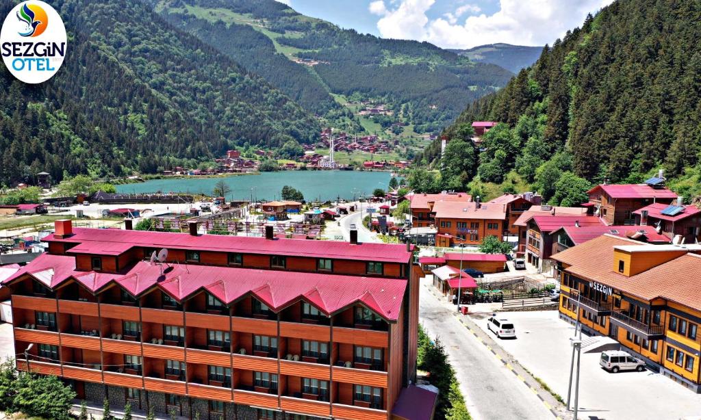 an aerial view of a town with a river and mountains at Sezgin Hotel in Uzungol