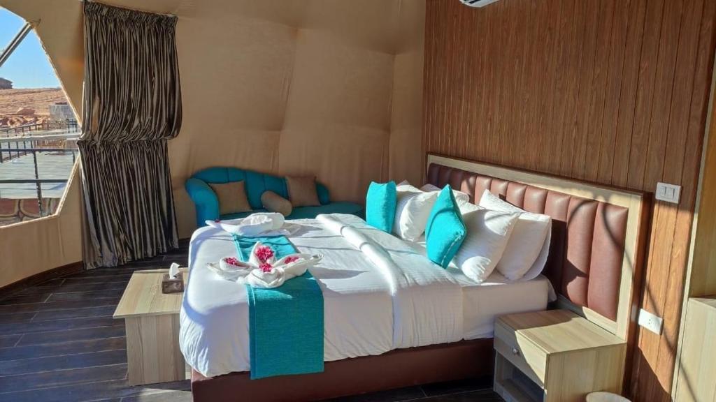 a bedroom with a bed on a cruise ship at Jori Luxury Camp in Wadi Rum