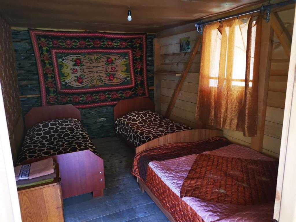 Postel nebo postele na pokoji v ubytování Guesthouse Everest