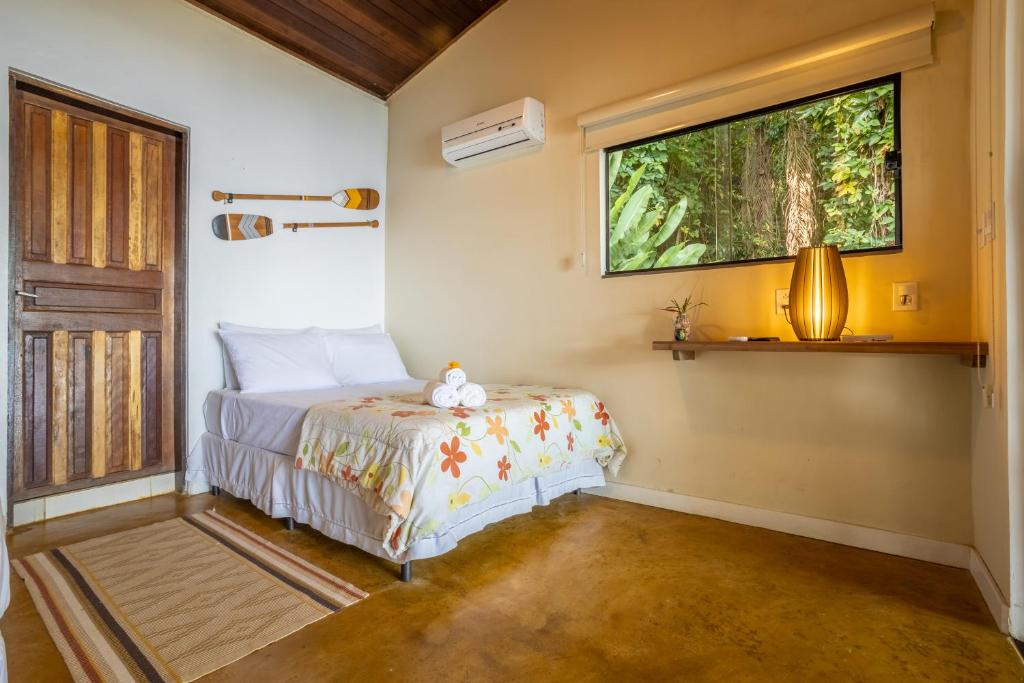 Cama ou camas em um quarto em Pousada Lagamar