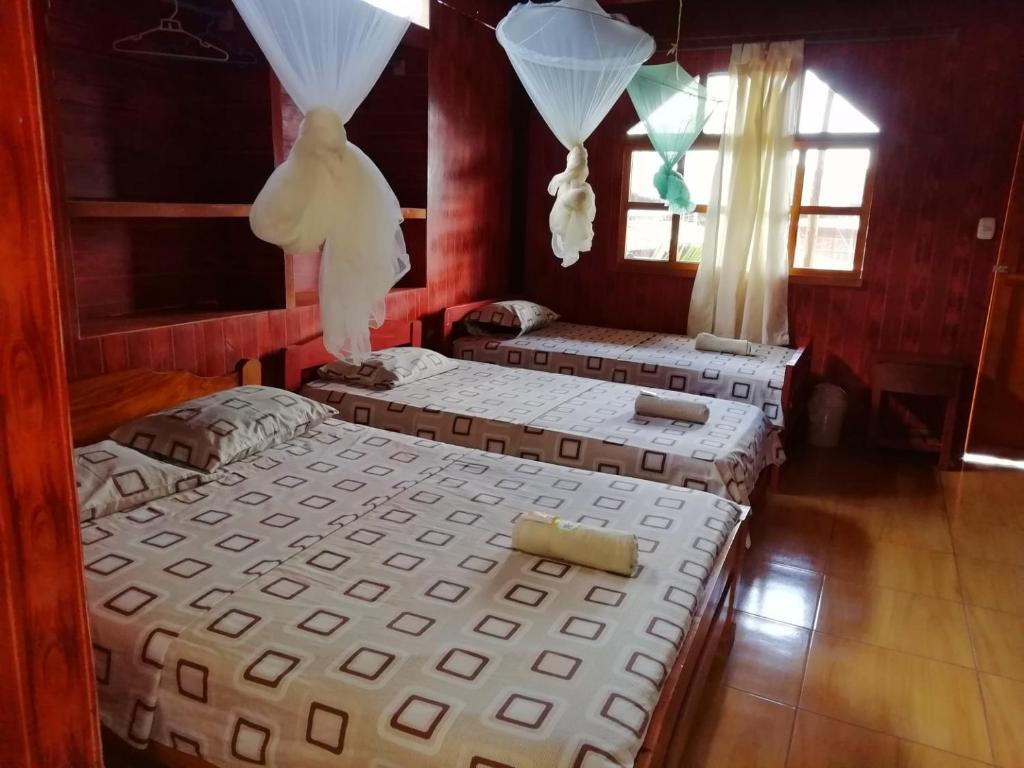 Postel nebo postele na pokoji v ubytování Madera Labrada Lodge Ecologico