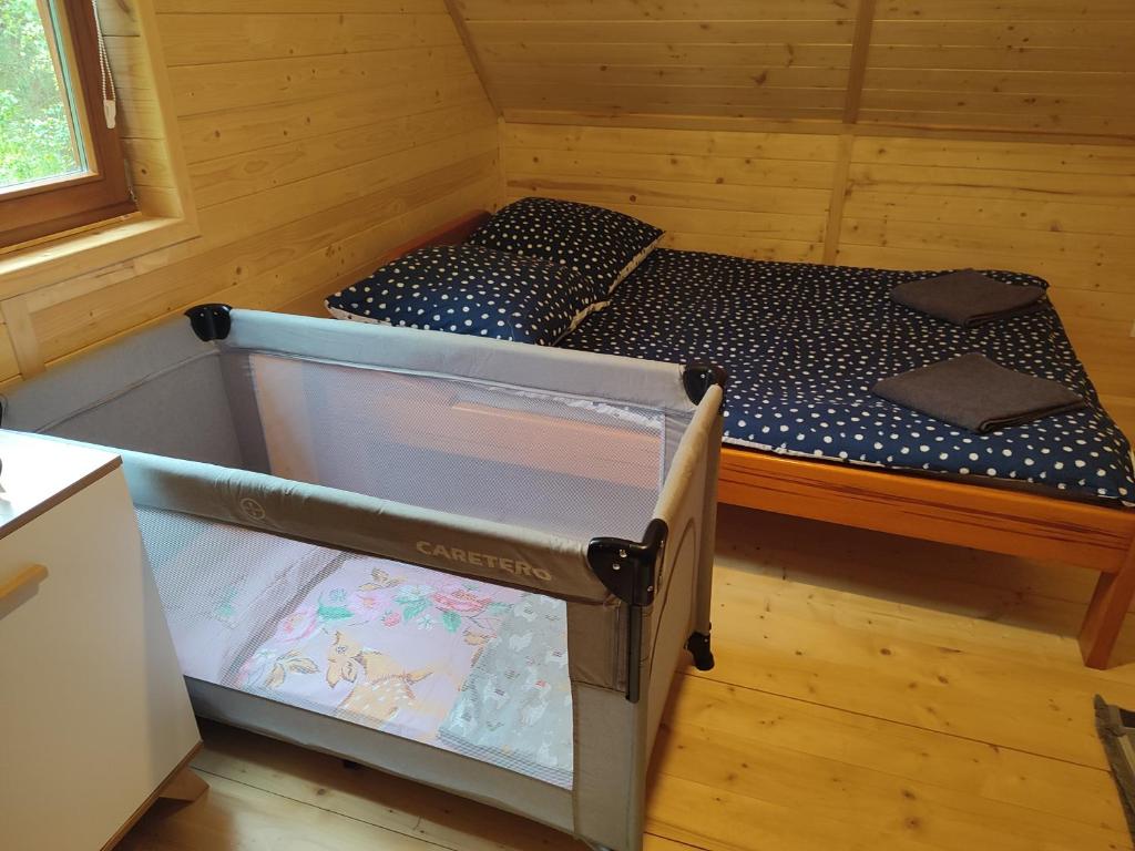 Posteľ alebo postele v izbe v ubytovaní Domek na Mazurach w otulinie leśnej "Leśne zacisze"