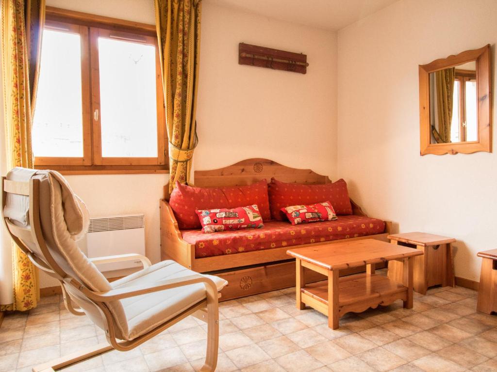 a living room with a couch and a chair at Appartement Aussois, 2 pièces, 4 personnes - FR-1-508-68 in Aussois