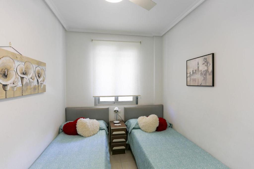 Postel nebo postele na pokoji v ubytování Cabo Roig La Rotonda, Pool, Beach & Comfort