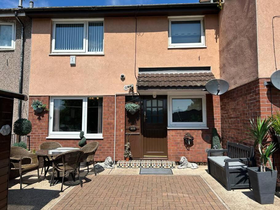 a brick house with a table and chairs in front of it at Central Aster House, 3 Bedrooms, Parking in Nottingham