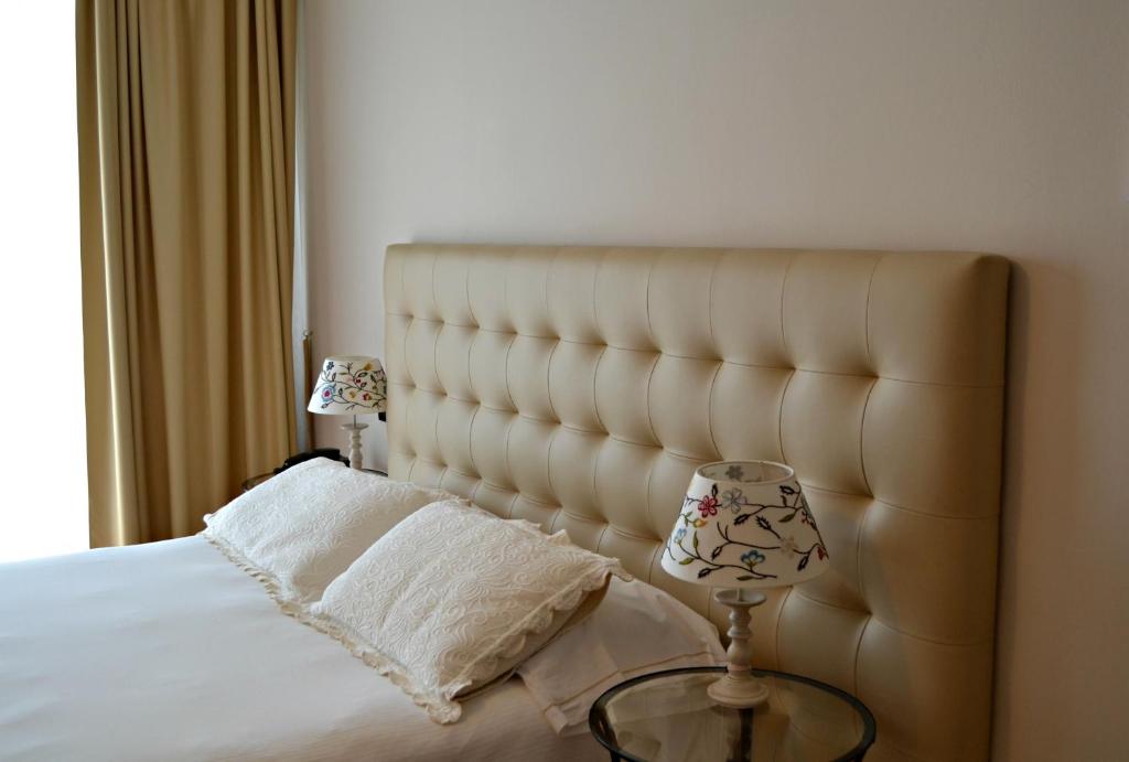 Łóżko lub łóżka w pokoju w obiekcie Il Sogno Apartments