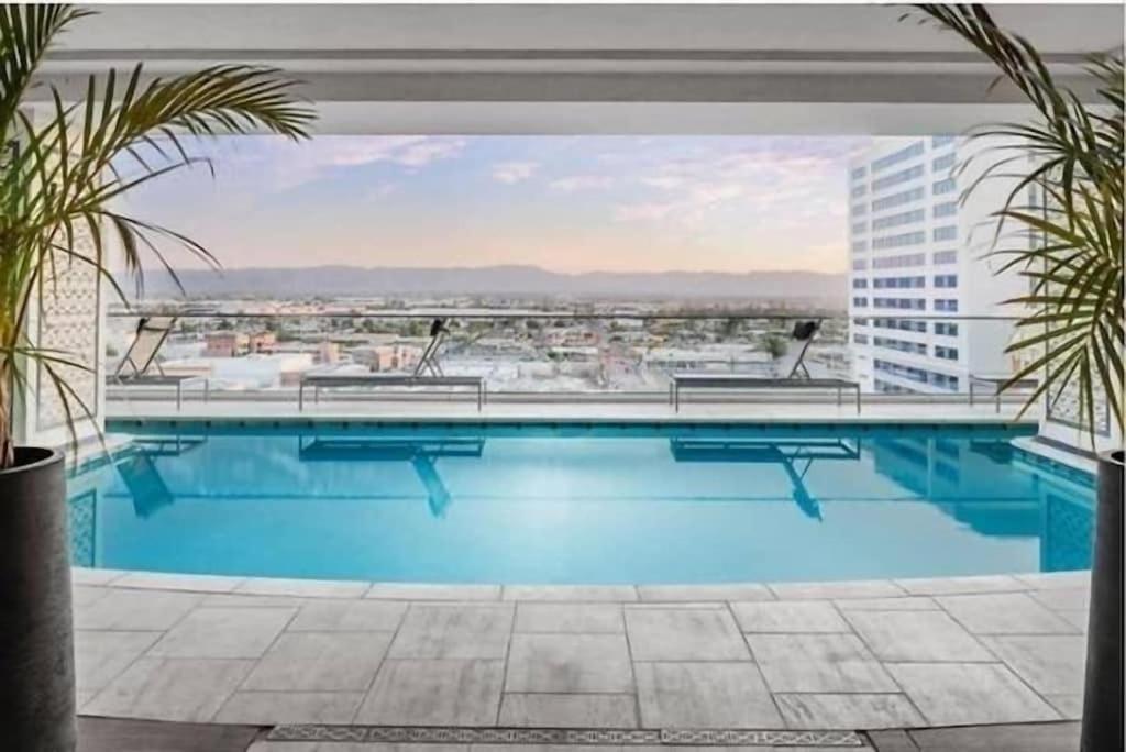 a large swimming pool on top of a building at HEART OF DOWNTOWN HIGHRISE CITY VIEWS in Phoenix