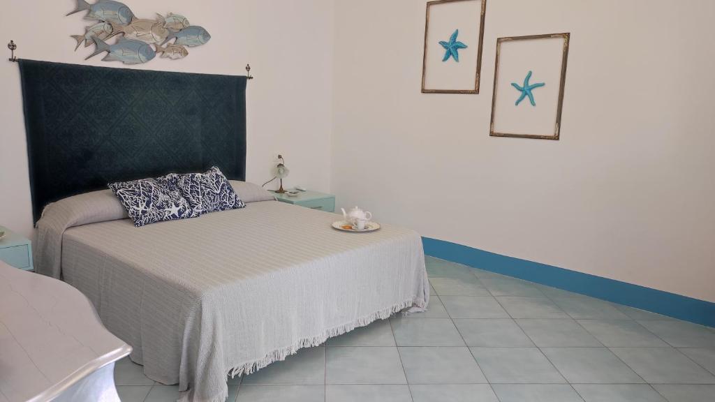 Postel nebo postele na pokoji v ubytování Sanacore - Maratea - Cersuta