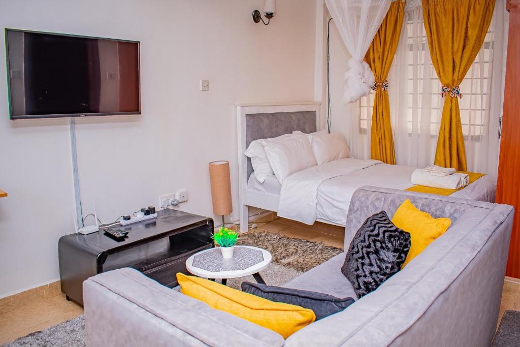 Postel nebo postele na pokoji v ubytování Belaire BnB Ruaka 1
