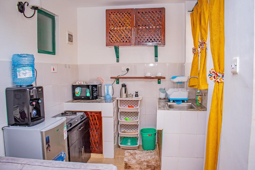 Kuchyň nebo kuchyňský kout v ubytování Belaire BnB Ruaka 1