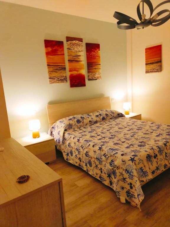 Postel nebo postele na pokoji v ubytování IL PICCOLO REMO