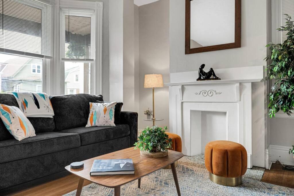 a living room with a couch and a table at Victorian Home in Mt. Washington in Pittsburgh