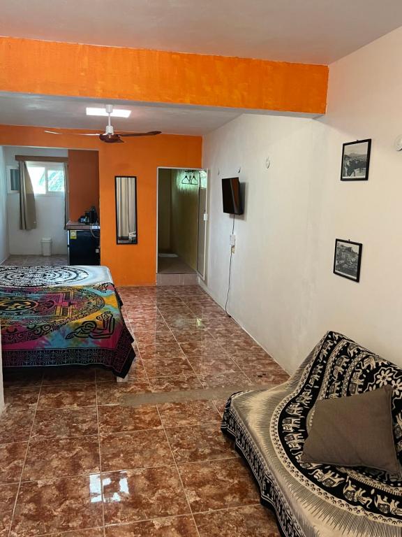 Postel nebo postele na pokoji v ubytování Casa Gajah Hotel Cuyo