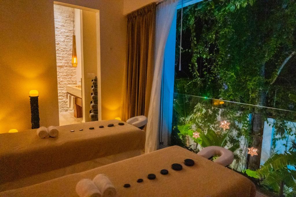 Postel nebo postele na pokoji v ubytování Olbil Hotel Boutique