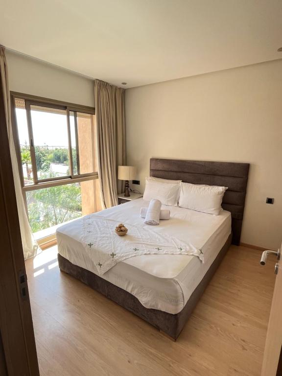 Ένα ή περισσότερα κρεβάτια σε δωμάτιο στο Appt Premium 3 rooms with big terrace at Prestigia Marrakech
