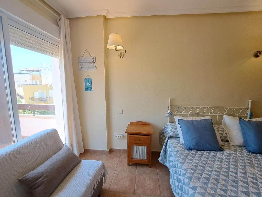 Posteľ alebo postele v izbe v ubytovaní Ático Lomas del Mar 1 - Vera Playa