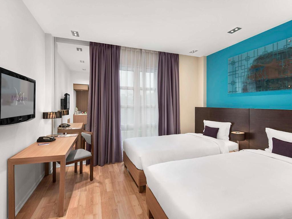 Postel nebo postele na pokoji v ubytování Mercure Hanoi La Gare Hotel