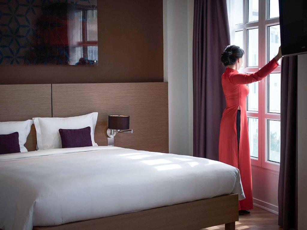 Postel nebo postele na pokoji v ubytování Mercure Hanoi La Gare Hotel