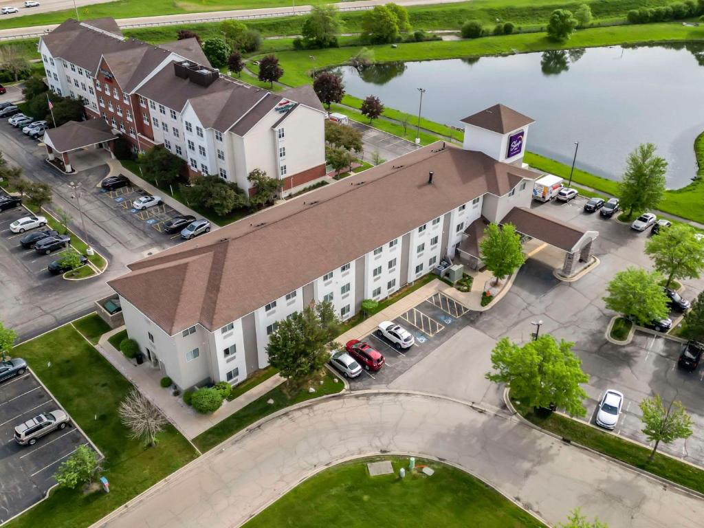an overhead view of a large white building with a brown roof at Sleep Inn in Naperville
