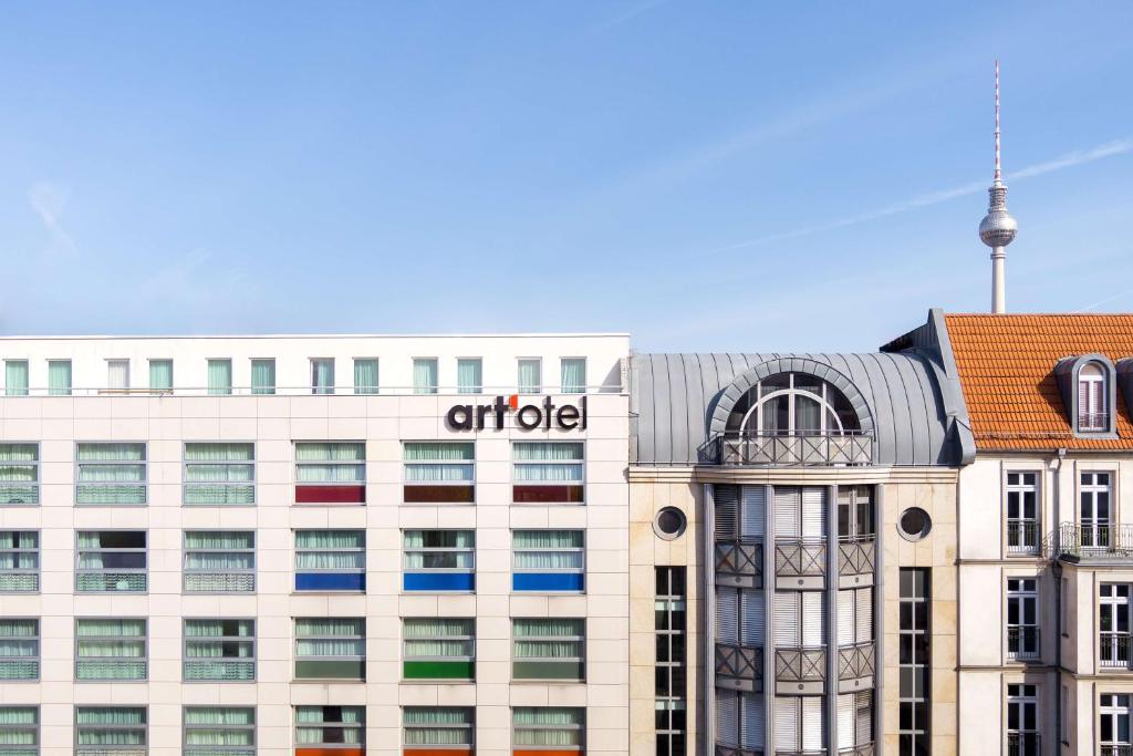 an office building with the citici sign on it at art'otel berlin mitte, Powered by Radisson Hotels in Berlin
