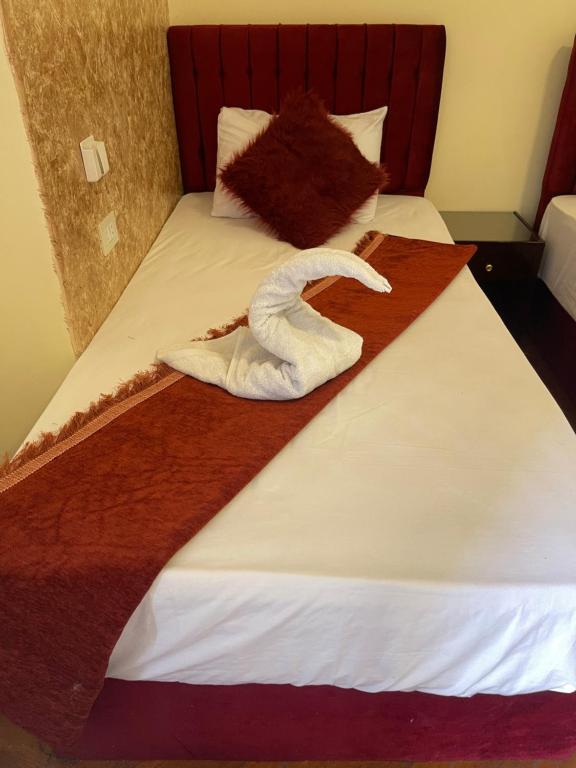Postel nebo postele na pokoji v ubytování New One Hotel