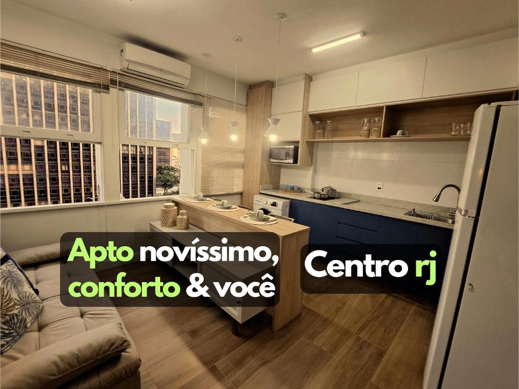 a kitchen with a couch and a table in a room at Novíssimo APTO metrô na porta VLT Centro Rio in Rio de Janeiro